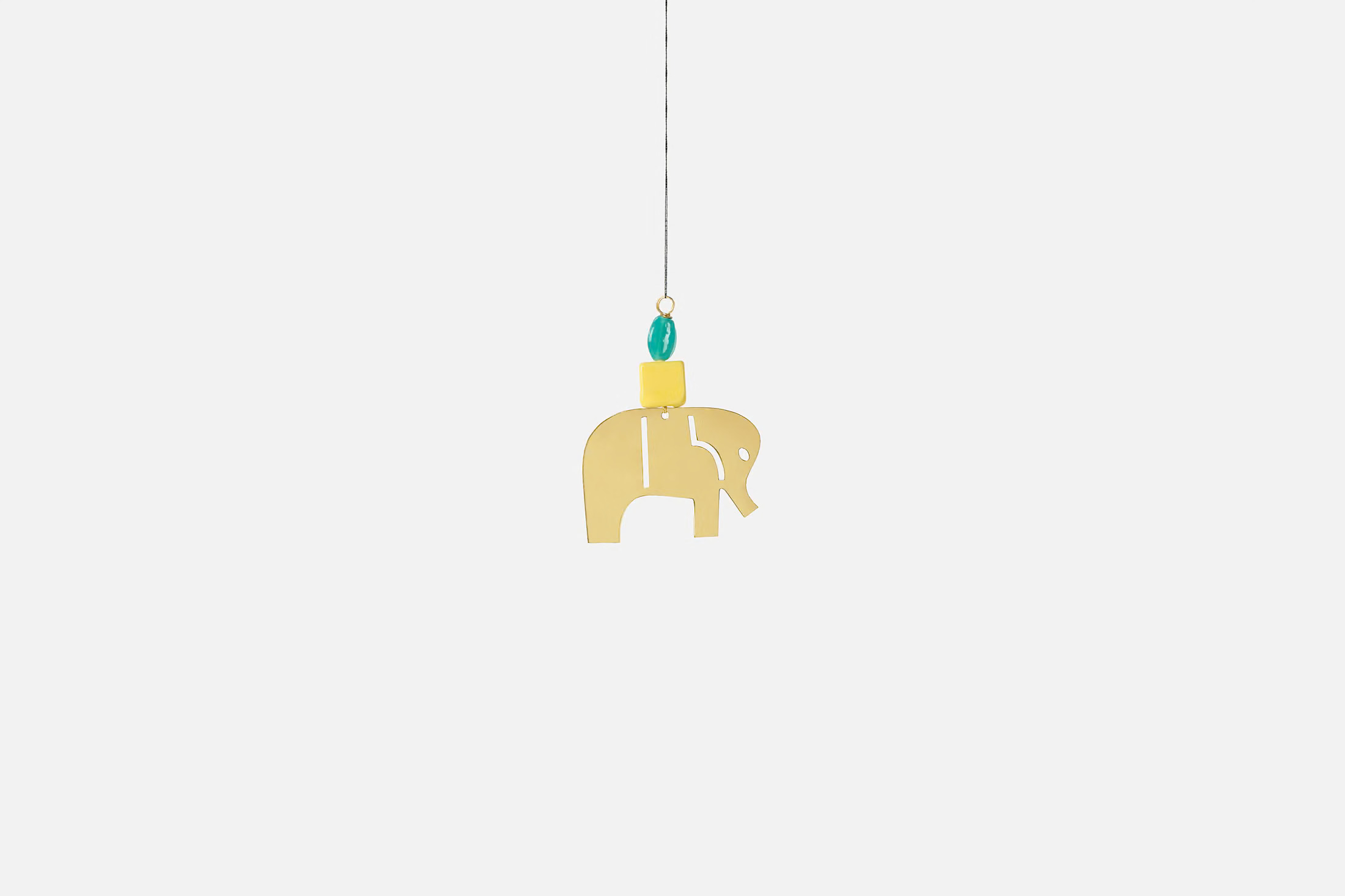svenskt-tenn_nkuli-mlangeni-berg_decorative-accessories_ornament-love-letter_yellow__brass--glass__116302_0_b8jr4c